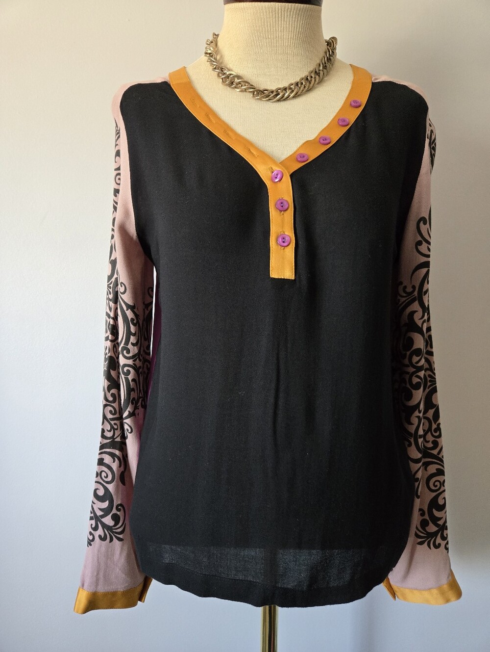 ST. MARTINS Black Front Purple Back Long Sleeve Top with Pink Patterned Sleeves.